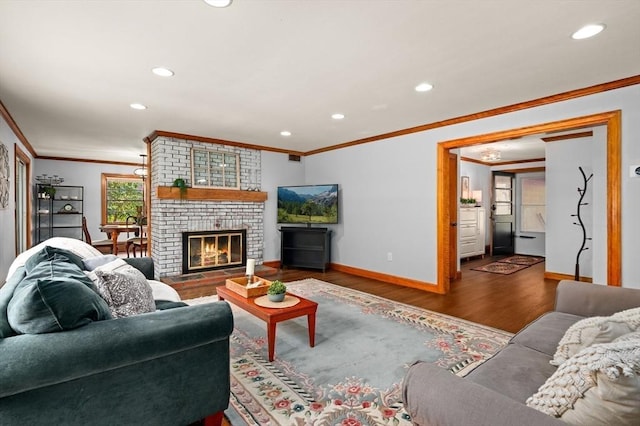 58 Spring St, Wakefield, MA 01880 - living room with crown molding, wood finished floors, recessed lighting, baseboards, and a fireplace