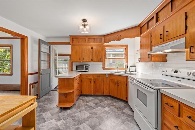 58 Spring St, Wakefield, MA 01880 - kitchen with white appliances, under cabinet range hood, open shelves, light countertops, and backsplash