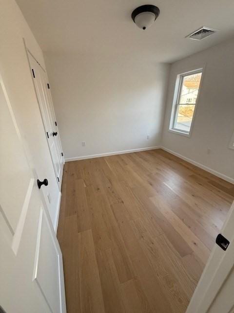 empty room with light wood-type flooring