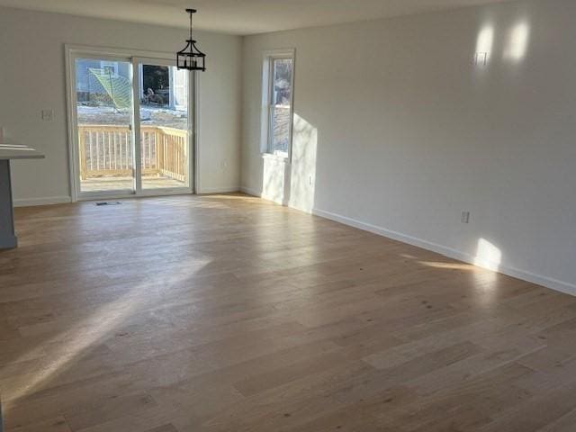 unfurnished dining area featuring hardwood / wood-style flooring