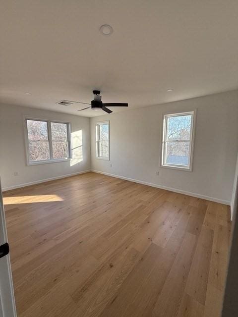 spare room with ceiling fan and light hardwood / wood-style flooring