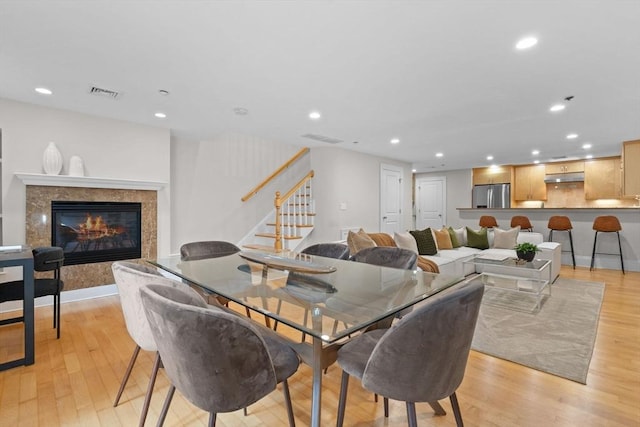 80 Worcester St Unit A, Boston, MA 02118 - dining space with stairway, light wood-style floors, recessed lighting, and a high end fireplace