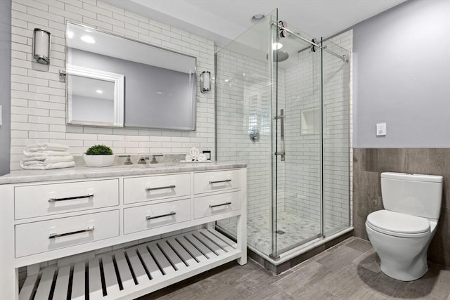 80 Worcester St Unit A, Boston, MA 02118 - bathroom with tile walls, vanity, a shower stall, and a wainscoted wall
