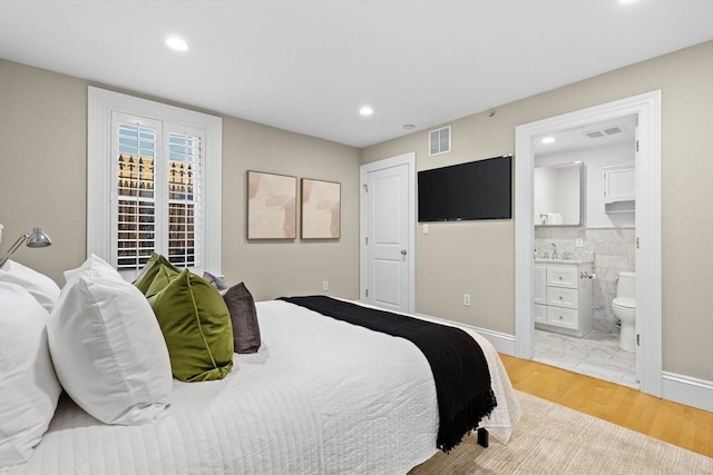 80 Worcester St Unit A, Boston, MA 02118 - bedroom with light wood finished floors, recessed lighting, and ensuite bath