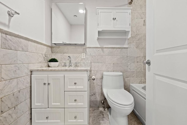 80 Worcester St Unit A, Boston, MA 02118 - bathroom featuring tile walls, vanity, and a bathtub