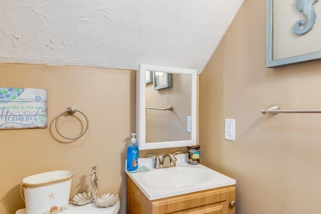 7 Mount Dustin Ave, Haverhill, MA 01832 - half bathroom with vanity, a textured ceiling, and vaulted ceiling
