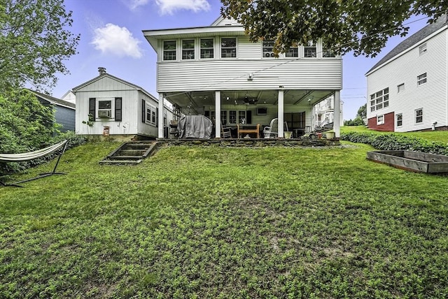 7 Mount Dustin Ave, Haverhill, MA 01832 - back of property with a vegetable garden, a lawn, and a patio area