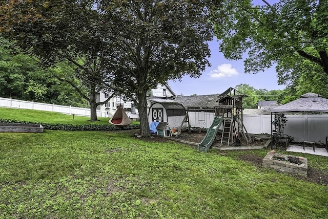 7 Mount Dustin Ave, Haverhill, MA 01832 - fenced backyard featuring a playground and a storage shed