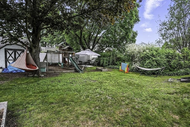 7 Mount Dustin Ave, Haverhill, MA 01832 - view of grassy yard featuring a playground and a shed