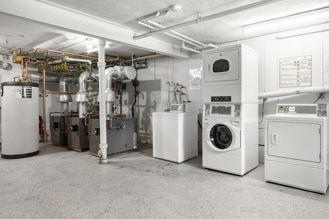 51 Warren St Unit 2-2, Waltham, MA 02453 - clothes washing area with a heating unit, stacked washing maching and dryer, washing machine and dryer, and water heater