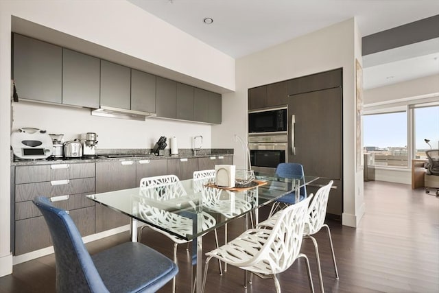 110 Stuart St Unit 24H, Boston, MA 02116 - dining area with dark wood-style floors and baseboards