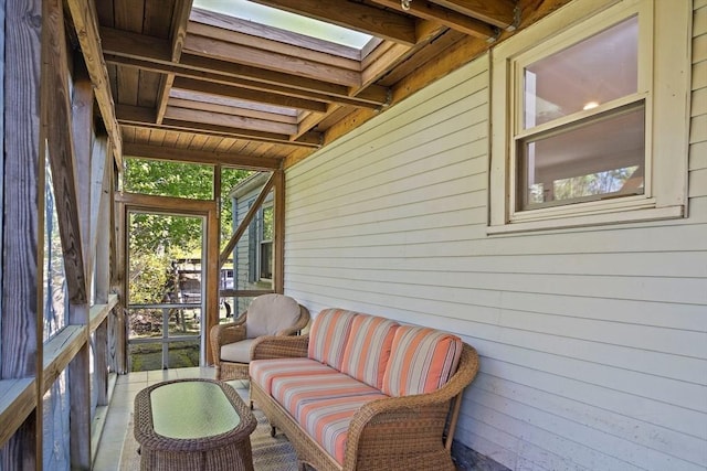 sunroom / solarium with an outdoor hangout area and a skylight