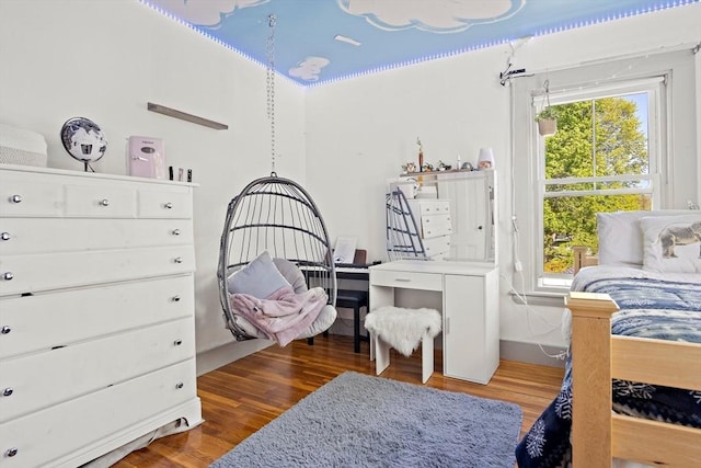 bedroom featuring wood finished floors