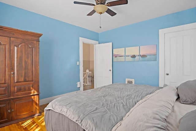 bedroom featuring a ceiling fan and wood finished floors