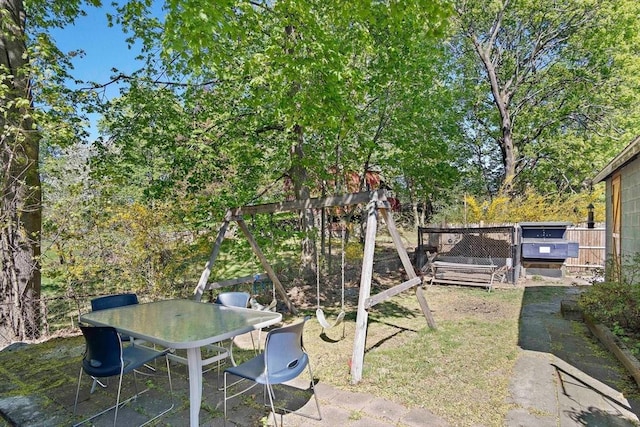 view of yard featuring a patio and outdoor dining area