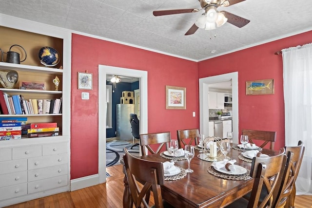 dining room featuring ceiling fan and wood finished floors