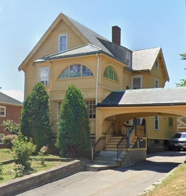 664 Washington St, Boston, MA 02135 - view of front of property with a chimney and stairway