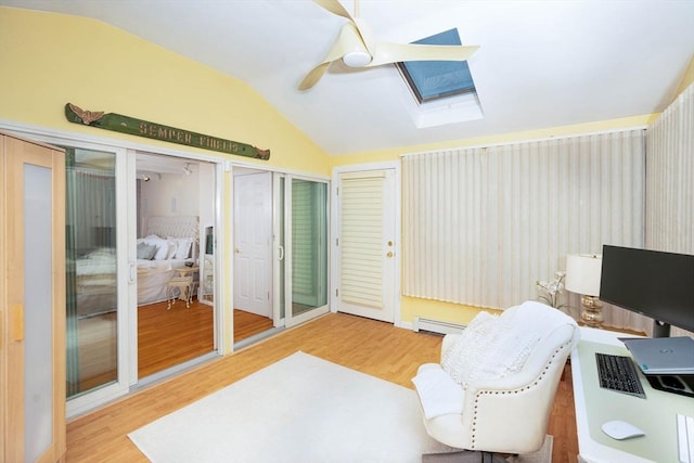 33 Samoset Ave, Quincy, MA 02169 - office area featuring a skylight, wood finished floors, vaulted ceiling, ceiling fan, and a baseboard heating unit