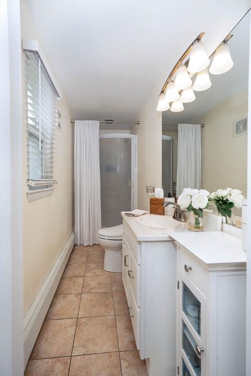 33 Samoset Ave, Quincy, MA 02169 - full bath with vanity, a shower with shower curtain, toilet, and tile patterned floors