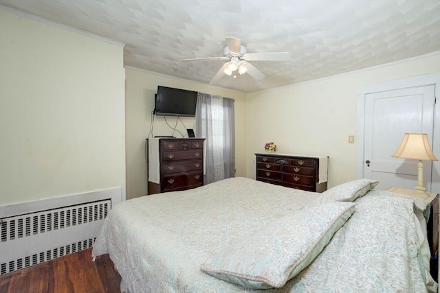 33 Samoset Ave, Quincy, MA 02169 - bedroom featuring radiator heating unit, crown molding, wood finished floors, and ceiling fan