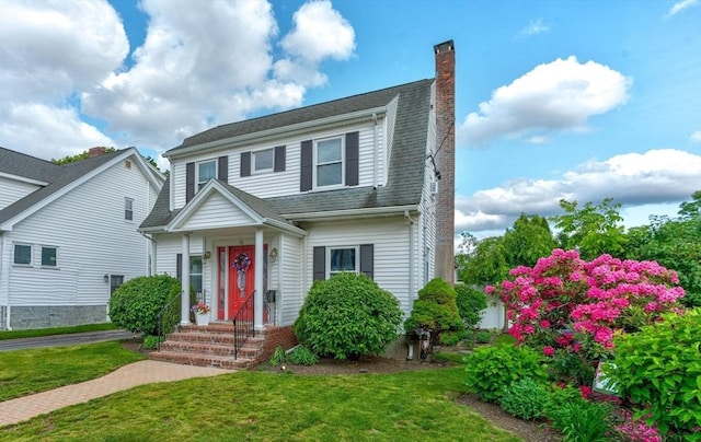 33 Samoset Ave, Quincy, MA 02169 - view of front of home featuring a chimney and a front lawn