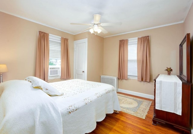 33 Samoset Ave, Quincy, MA 02169 - bedroom with multiple windows, wood finished floors, baseboards, a ceiling fan, and crown molding
