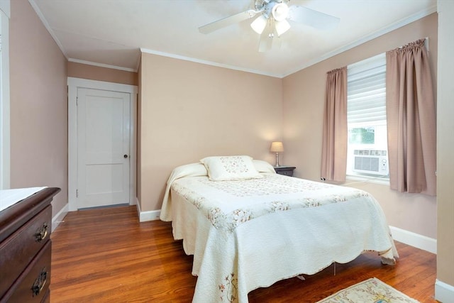 33 Samoset Ave, Quincy, MA 02169 - bedroom featuring baseboards, wood finished floors, ornamental molding, a ceiling fan, and cooling unit