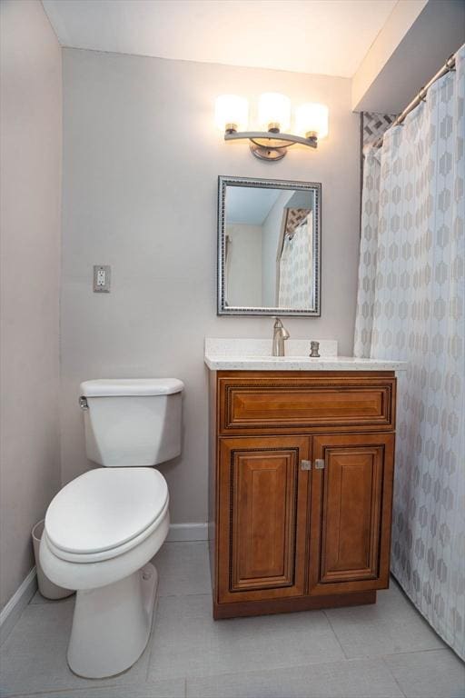 33 Samoset Ave, Quincy, MA 02169 - bathroom with baseboards, vanity, toilet, and tile patterned flooring