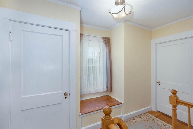 33 Samoset Ave, Quincy, MA 02169 - mudroom with ornamental molding, light wood finished floors, and baseboards