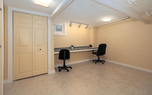 33 Samoset Ave, Quincy, MA 02169 - office with baseboards, track lighting, light tile patterned floors, and built in desk