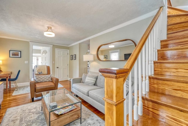 215 Curve, Dedham, MA 02026 - living area featuring wood finished floors, stairway, ornamental molding, a textured ceiling, and baseboards