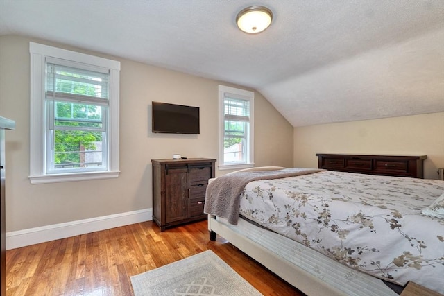 215 Curve, Dedham, MA 02026 - bedroom featuring vaulted ceiling, light wood-type flooring, and baseboards