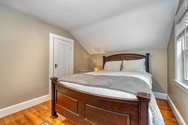 215 Curve, Dedham, MA 02026 - bedroom with lofted ceiling, light wood finished floors, and baseboards