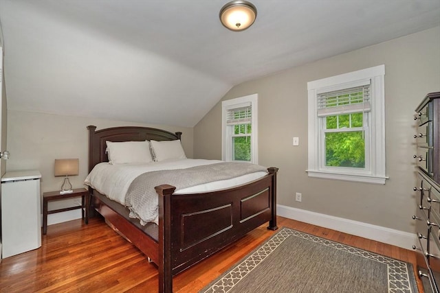 215 Curve, Dedham, MA 02026 - bedroom featuring baseboards, lofted ceiling, and wood finished floors