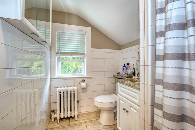 215 Curve, Dedham, MA 02026 - full bathroom with radiator, tile walls, toilet, lofted ceiling, and vanity