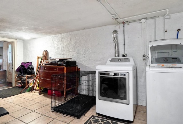 215 Curve, Dedham, MA 02026 - washroom featuring washing machine and clothes dryer, light tile patterned floors, and a textured wall