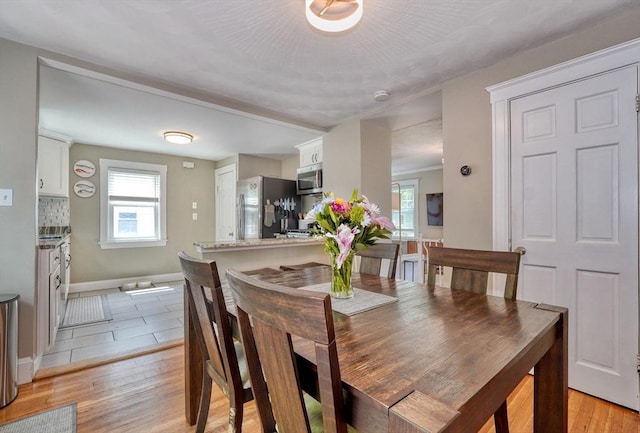 215 Curve, Dedham, MA 02026 - dining area featuring light wood-type flooring and baseboards