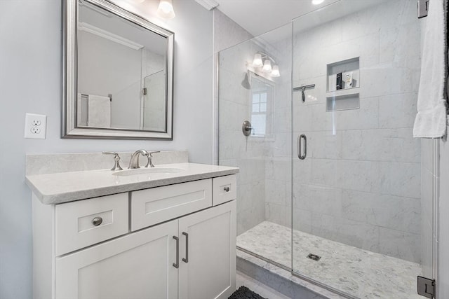 full bath featuring a stall shower and vanity