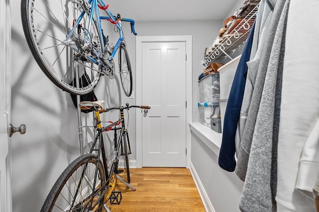 spacious closet featuring light wood-type flooring