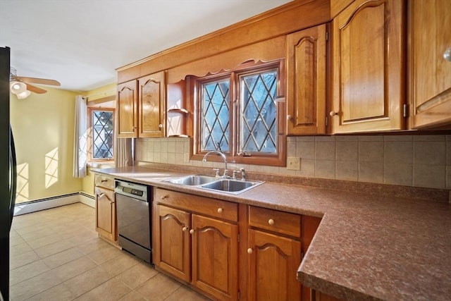 kitchen with sink, a baseboard heating unit, black dishwasher, light tile patterned flooring, and decorative backsplash