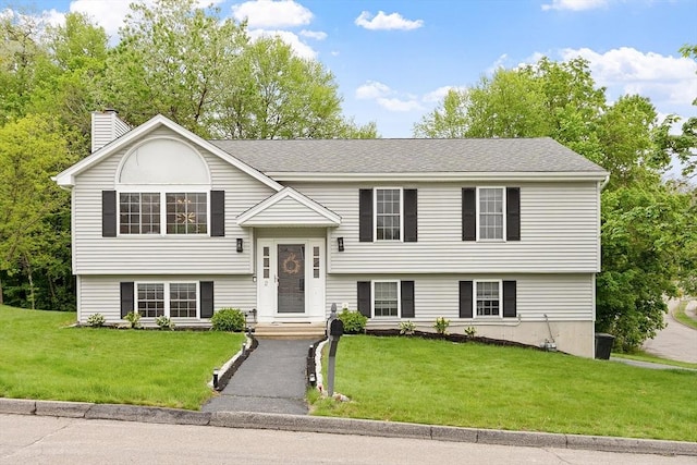 2 Pinebrook Ln, Worcester, MA 01609 - split foyer home with a front yard, a chimney, and roof with shingles