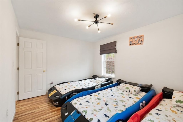 2 Pinebrook Ln, Worcester, MA 01609 - bedroom with wood finished floors and a chandelier