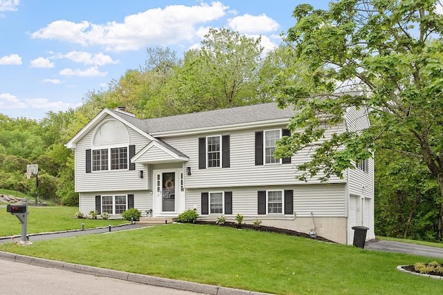 2 Pinebrook Ln, Worcester, MA 01609 - raised ranch with a front yard, an attached garage, driveway, and a chimney