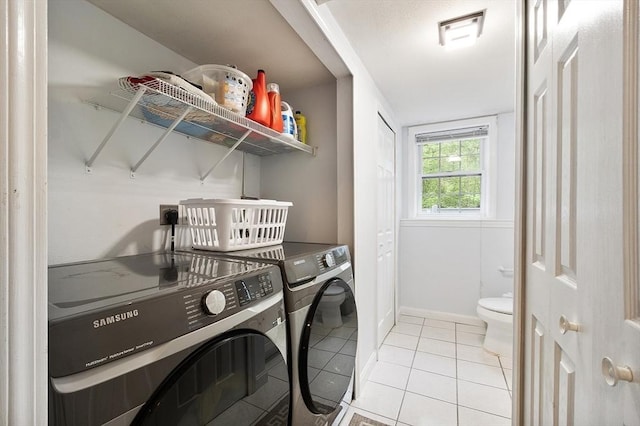 2 Pinebrook Ln, Worcester, MA 01609 - laundry room featuring washing machine and clothes dryer, light tile patterned floors, and baseboards
