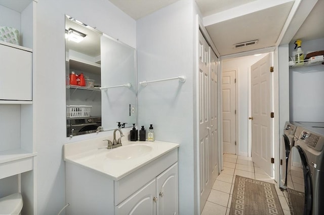 2 Pinebrook Ln, Worcester, MA 01609 - bathroom with washer and dryer, a closet, tile patterned floors, and vanity