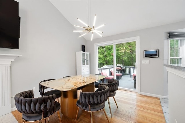 2 Pinebrook Ln, Worcester, MA 01609 - dining space featuring healthy amount of natural light, a chandelier, light wood-type flooring, vaulted ceiling, and baseboards