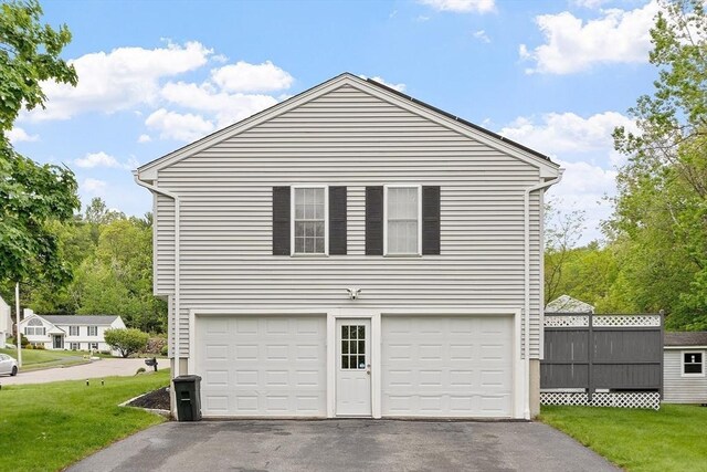 2 Pinebrook Ln, Worcester, MA 01609 - view of home's exterior with asphalt driveway, an attached garage, and a yard