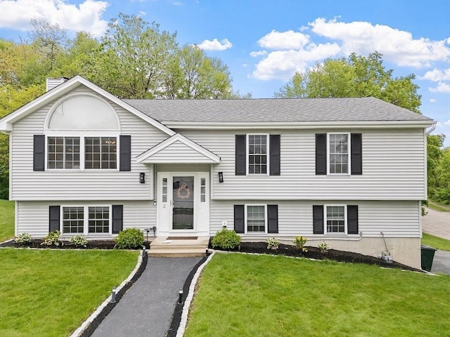 2 Pinebrook Ln, Worcester, MA 01609 - bi-level home featuring a front yard and roof with shingles