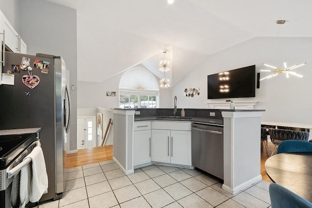 2 Pinebrook Ln, Worcester, MA 01609 - kitchen with appliances with stainless steel finishes, a sink, dark countertops, vaulted ceiling, and pendant lighting