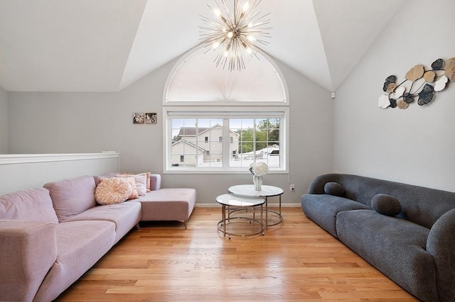2 Pinebrook Ln, Worcester, MA 01609 - living room with a chandelier, lofted ceiling, light wood-style floors, and baseboards